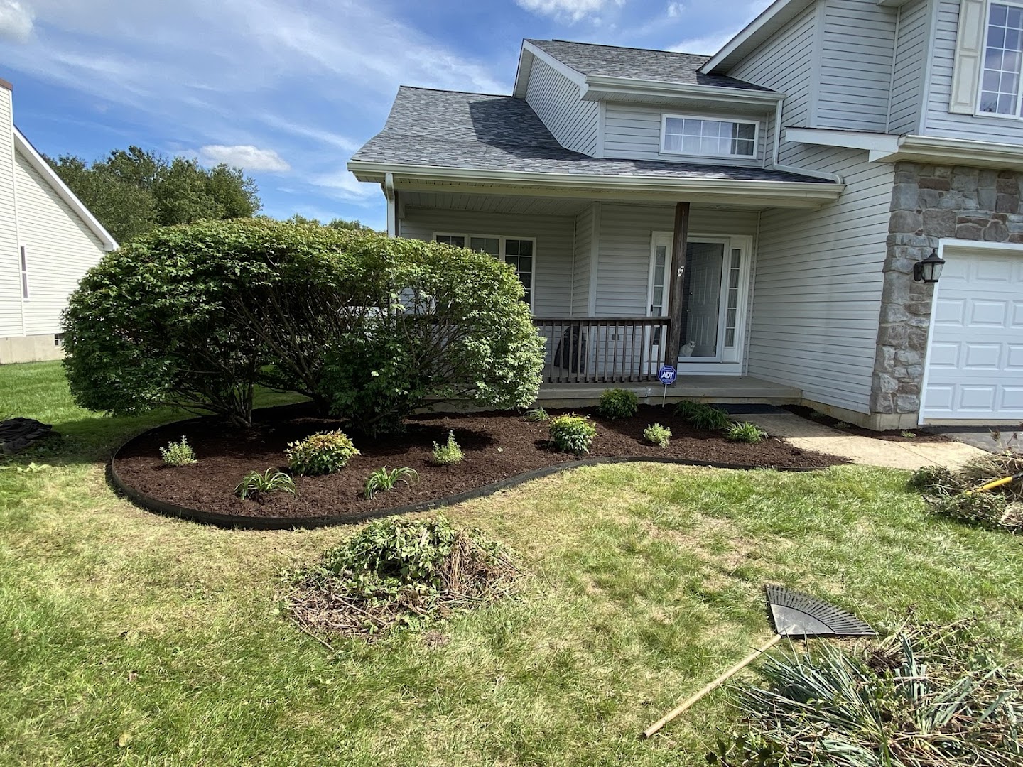 Home with manicured green lawn and shrubs, North East MD